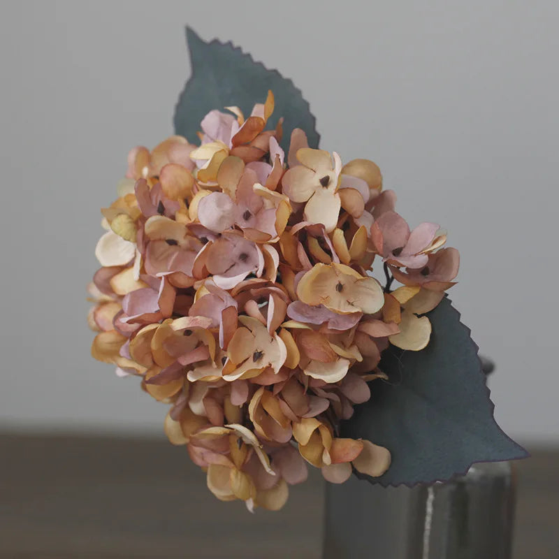 Lipsy artificial hydrangea brownish pink flower on gray background