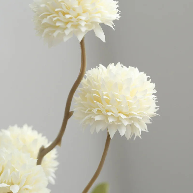 Close-up of white artificial dandelion flowers 