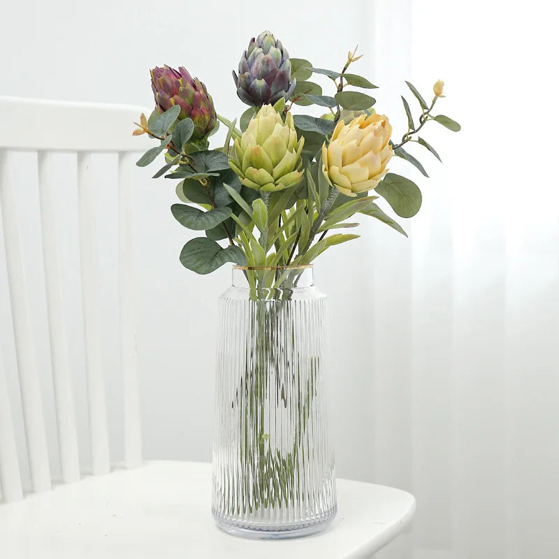Faux artichoke plant in clear vase - modern home decor arrangement