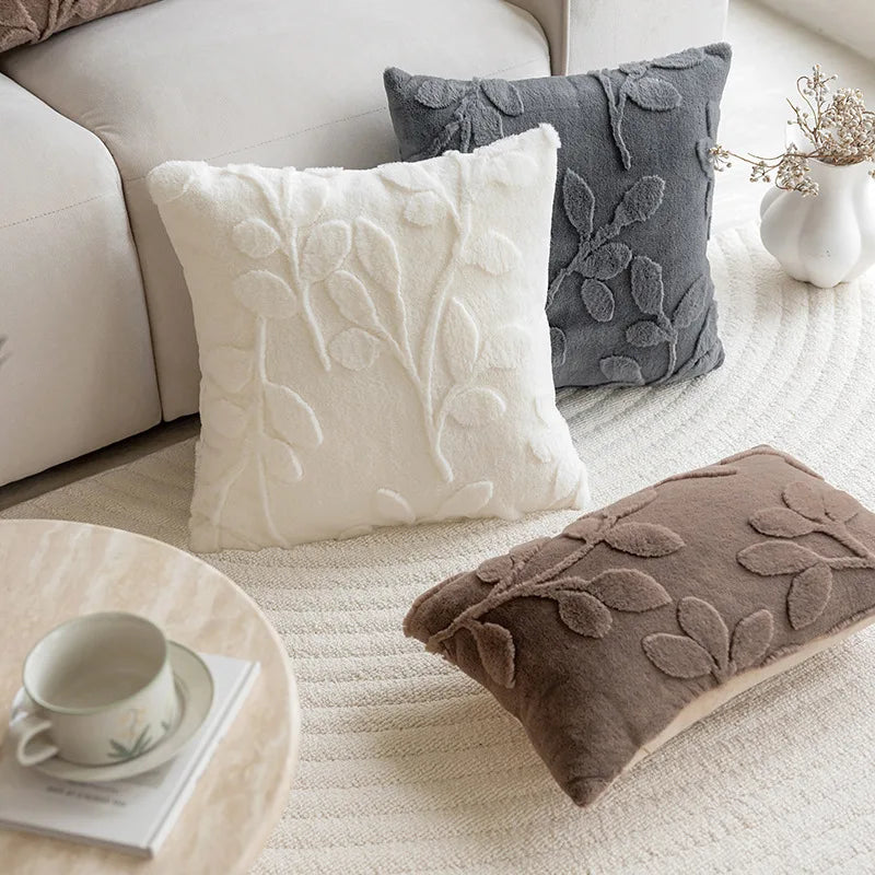 Close-up of plush jacquard throw pillow covers in neutral tones showing fabric texture
