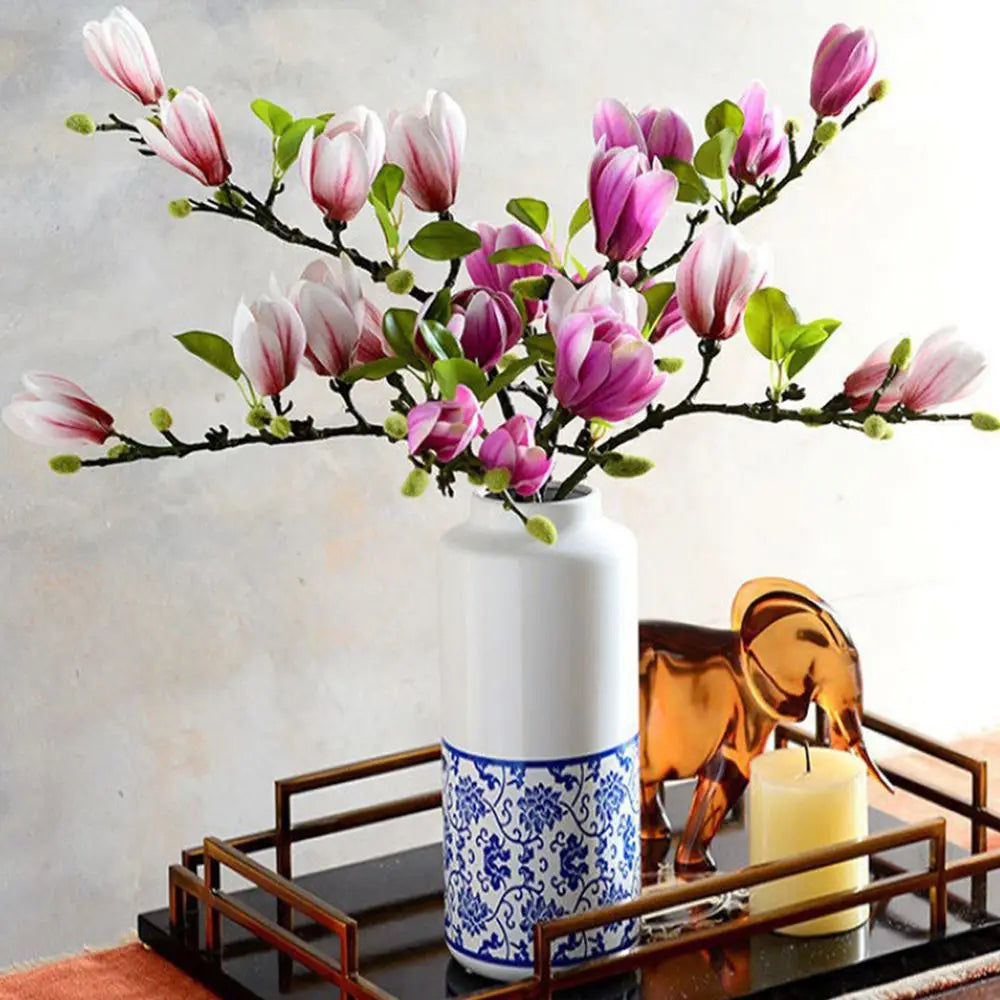 Pink magnolia artificial flower bouquet on table centerpiece display