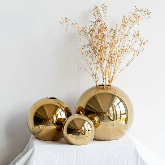 Caleb gold ball ceramic porcelain vases in three sizes with dried pampas grass arrangement