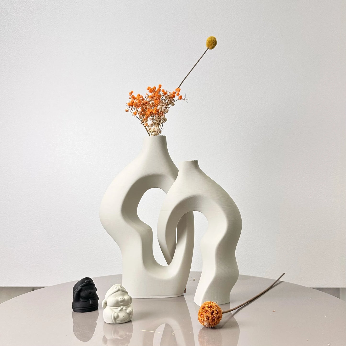 Hilly twisty artistic vases with dried flower arrangement - modern home decor styling