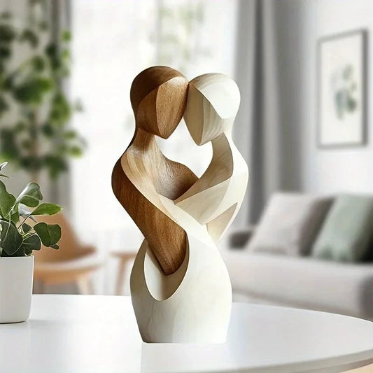 Nana wooden couple sculpture displayed on white shelf with green plant, modern minimalist home decor