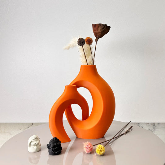 Noma plastic hug vase set of 2 in vibrant orange - 8.66" embracing design dried flower decor front view