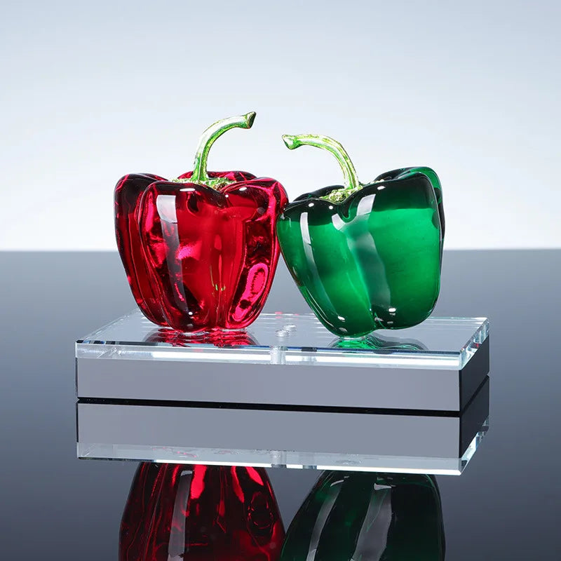 Handcrafted glass chili pepper ornament displayed on kitchen shelf as decorative accent