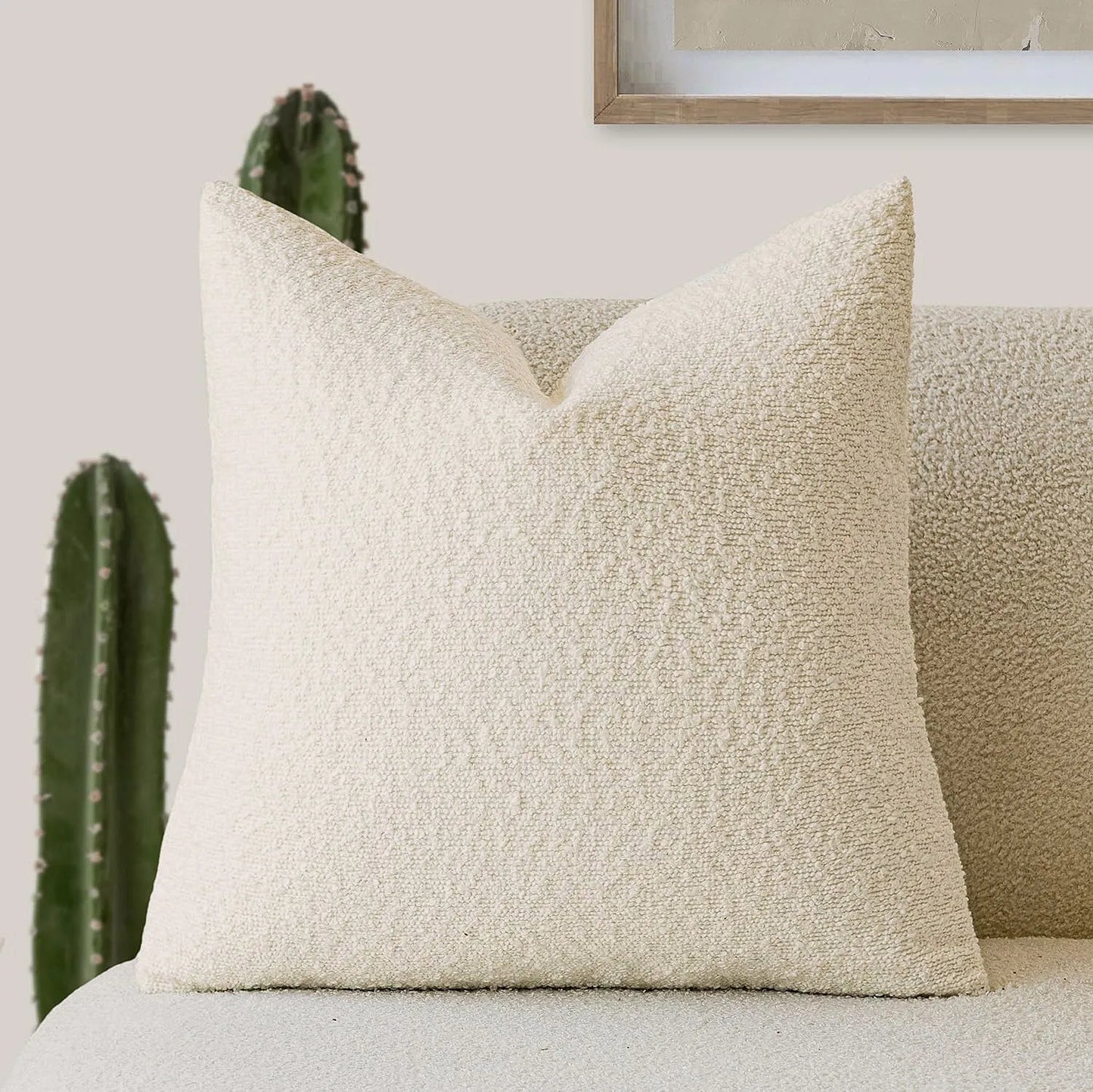 Xoco beige teddy fleece pillow cover styled on modern sofa in contemporary living room