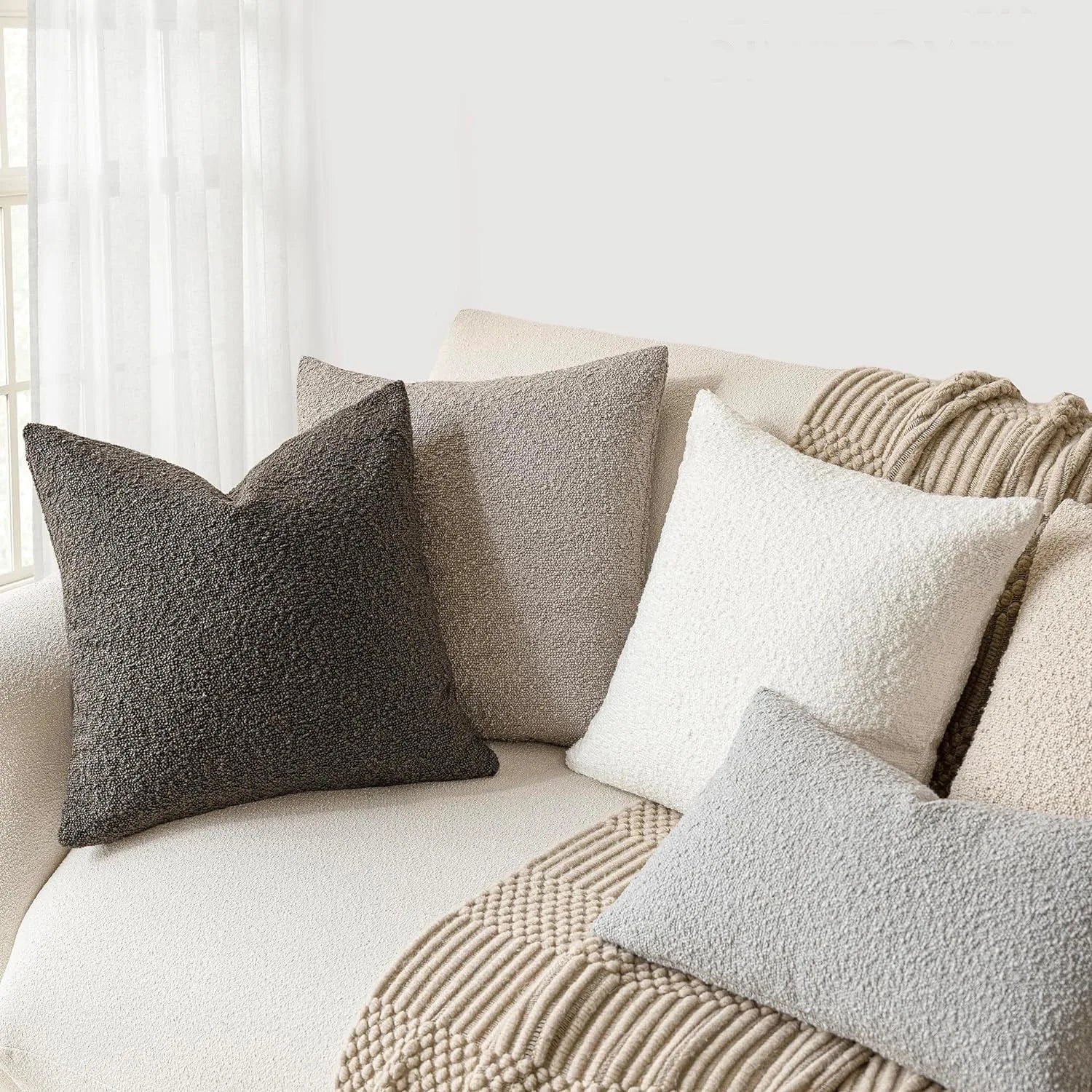 Xoco teddy fleece pillow cover styled on modern sofa in contemporary living room