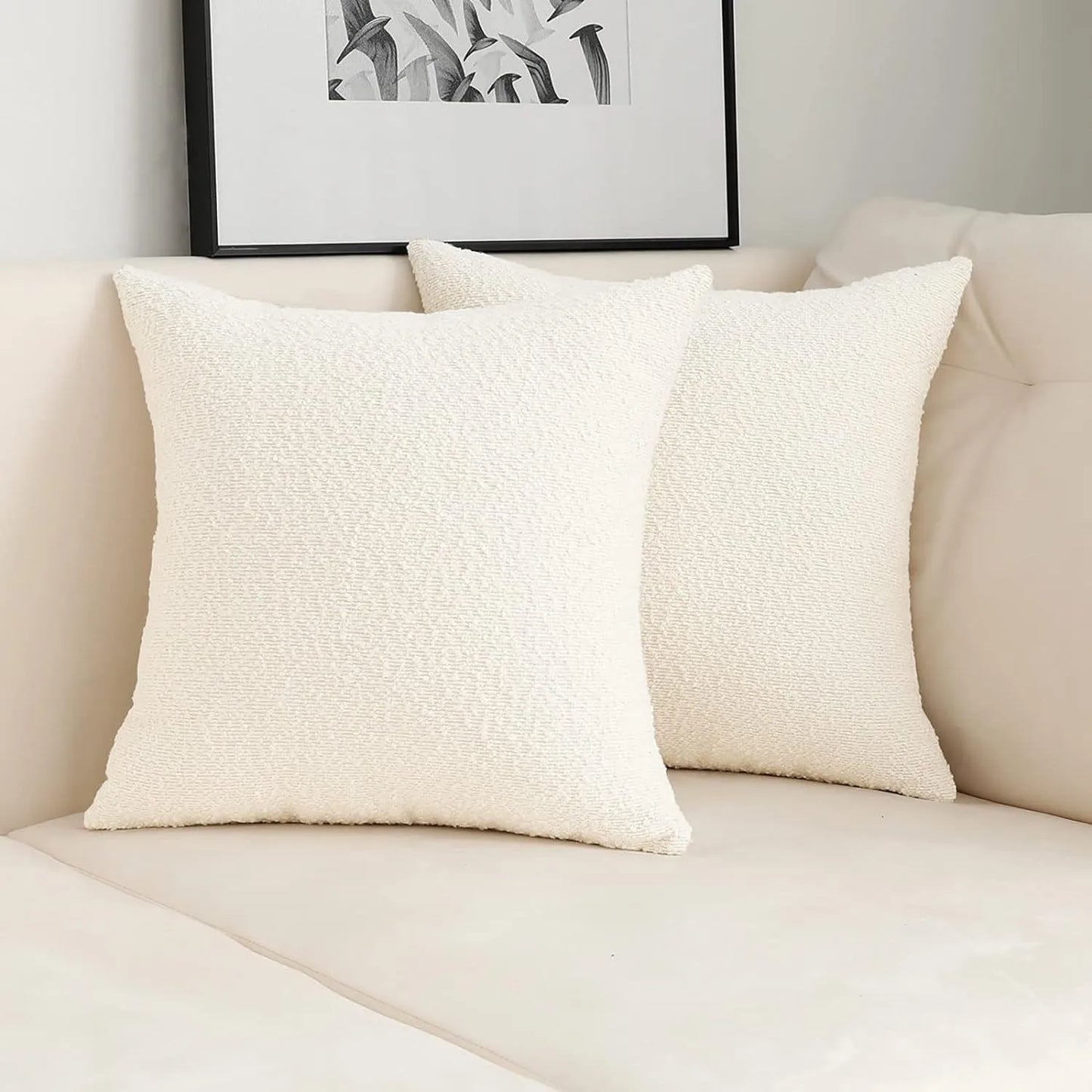 Xoco white teddy fleece pillow cover styled on modern sofa in contemporary living room